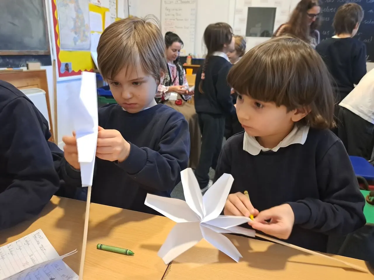 Children holding crafts