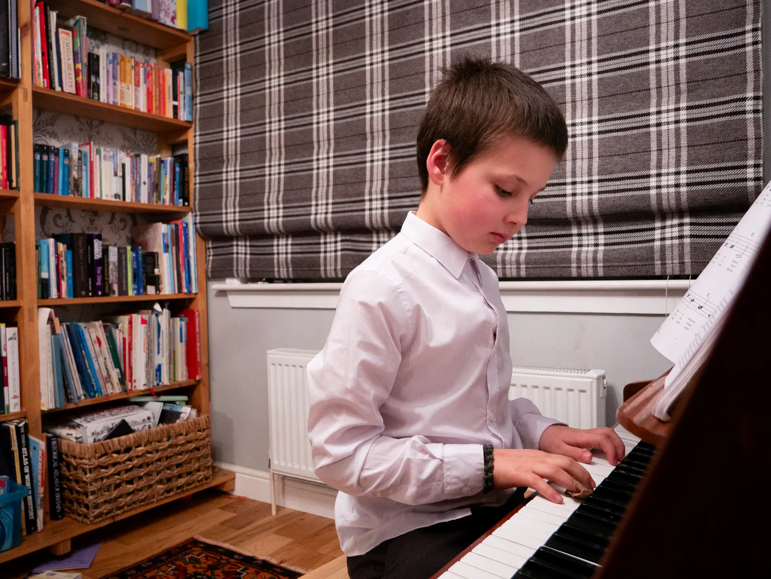 Child plays piano